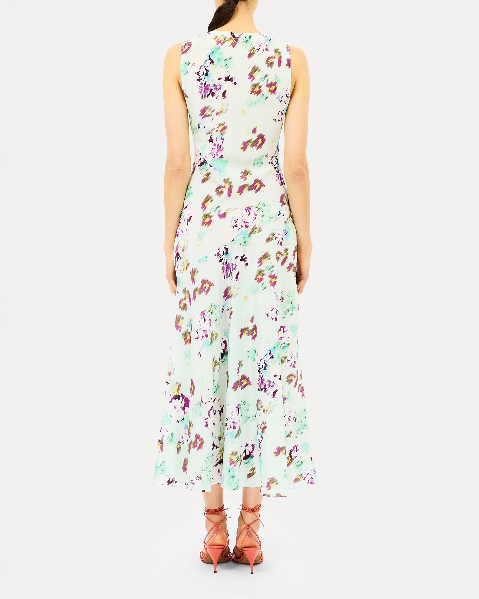 Woman wearing a floral dress on a white background