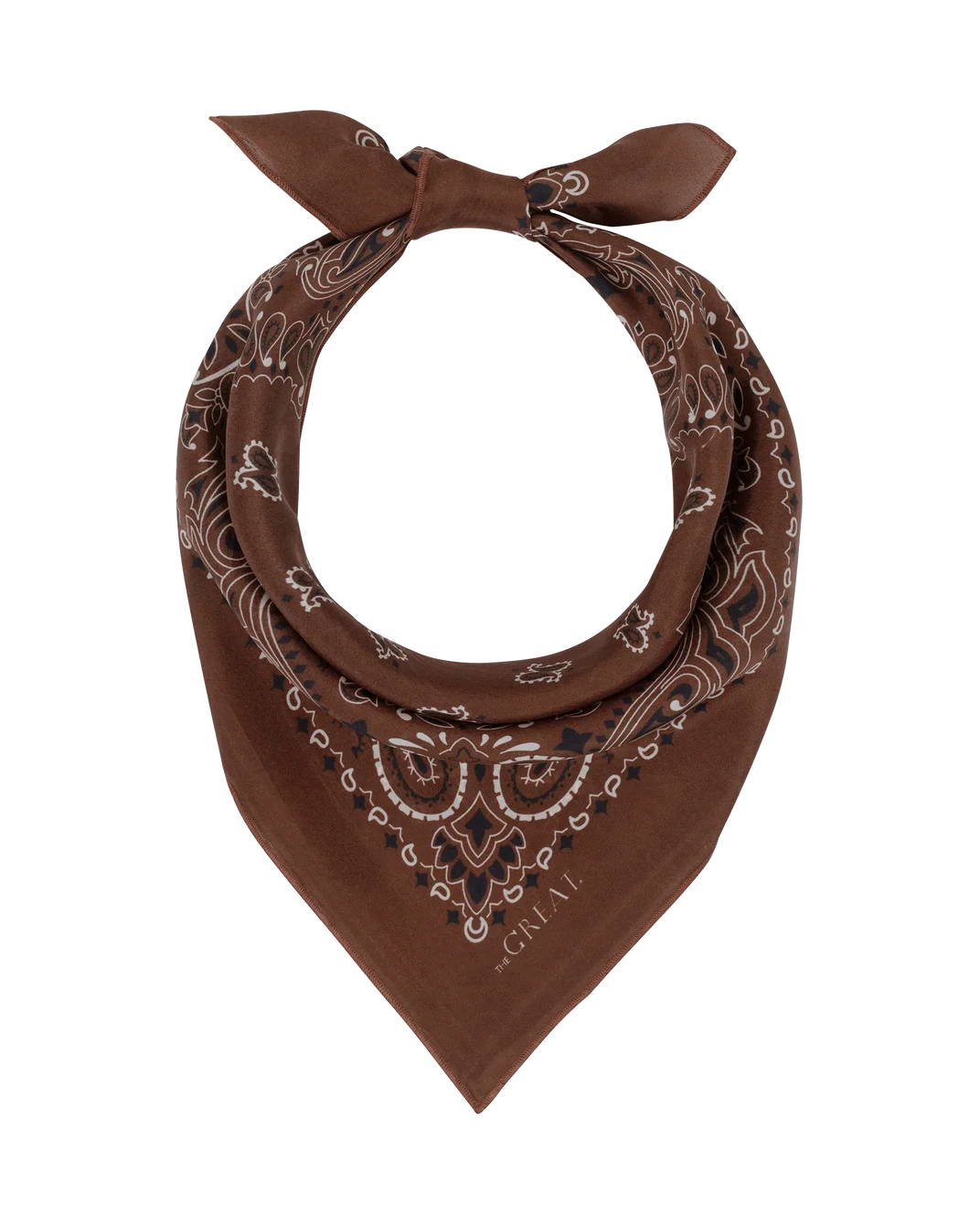 A brown bandana neck scarf with a white and black paisley pattern, tied in a knot at the top and featuring the brand name 'the GREATEST' printed near the bottom tip, set against a plain white background.