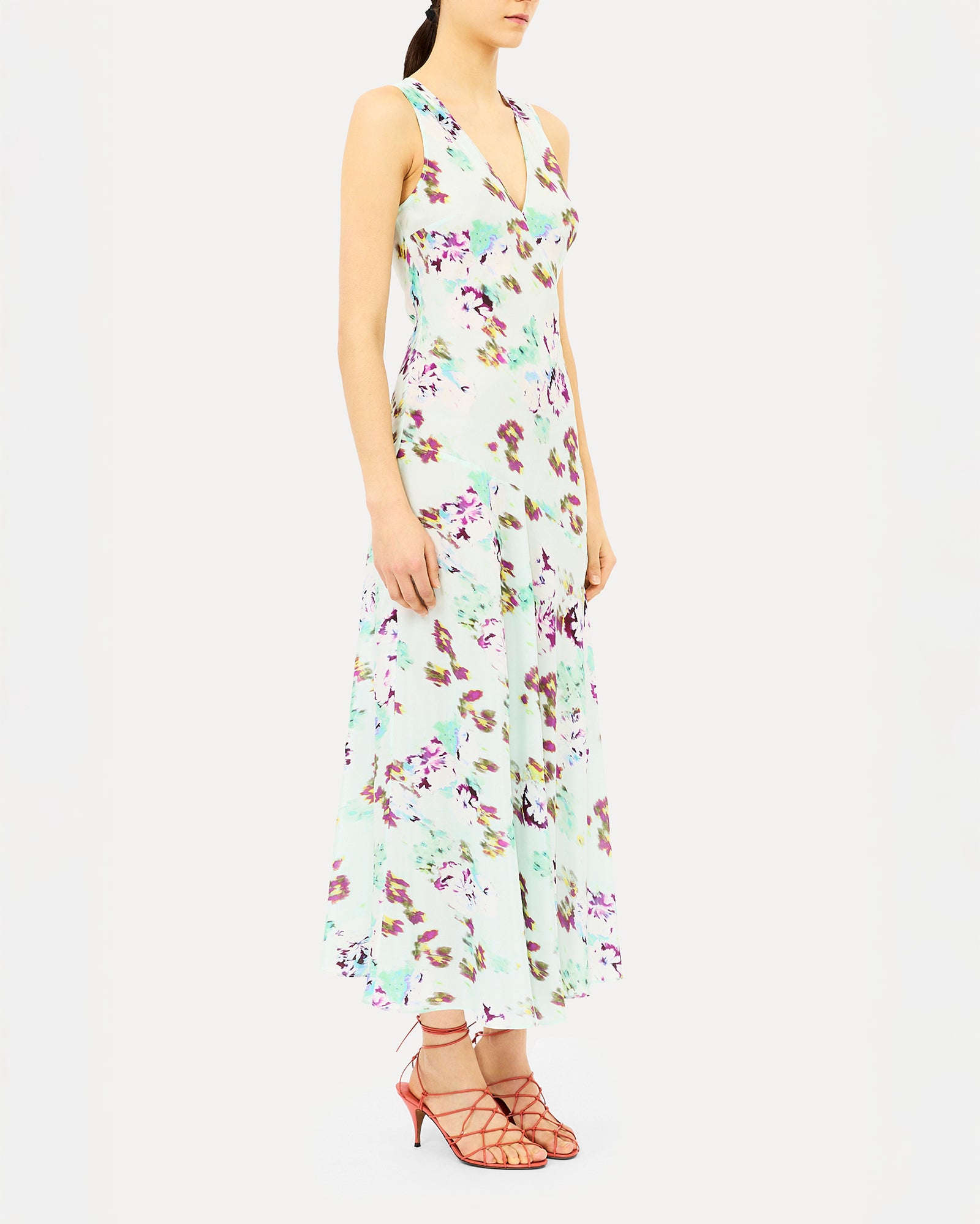 Woman wearing a floral dress on a white background