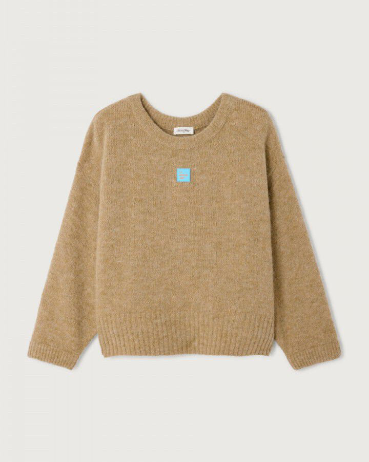 Beige sweater with a small blue logo on a light gray background