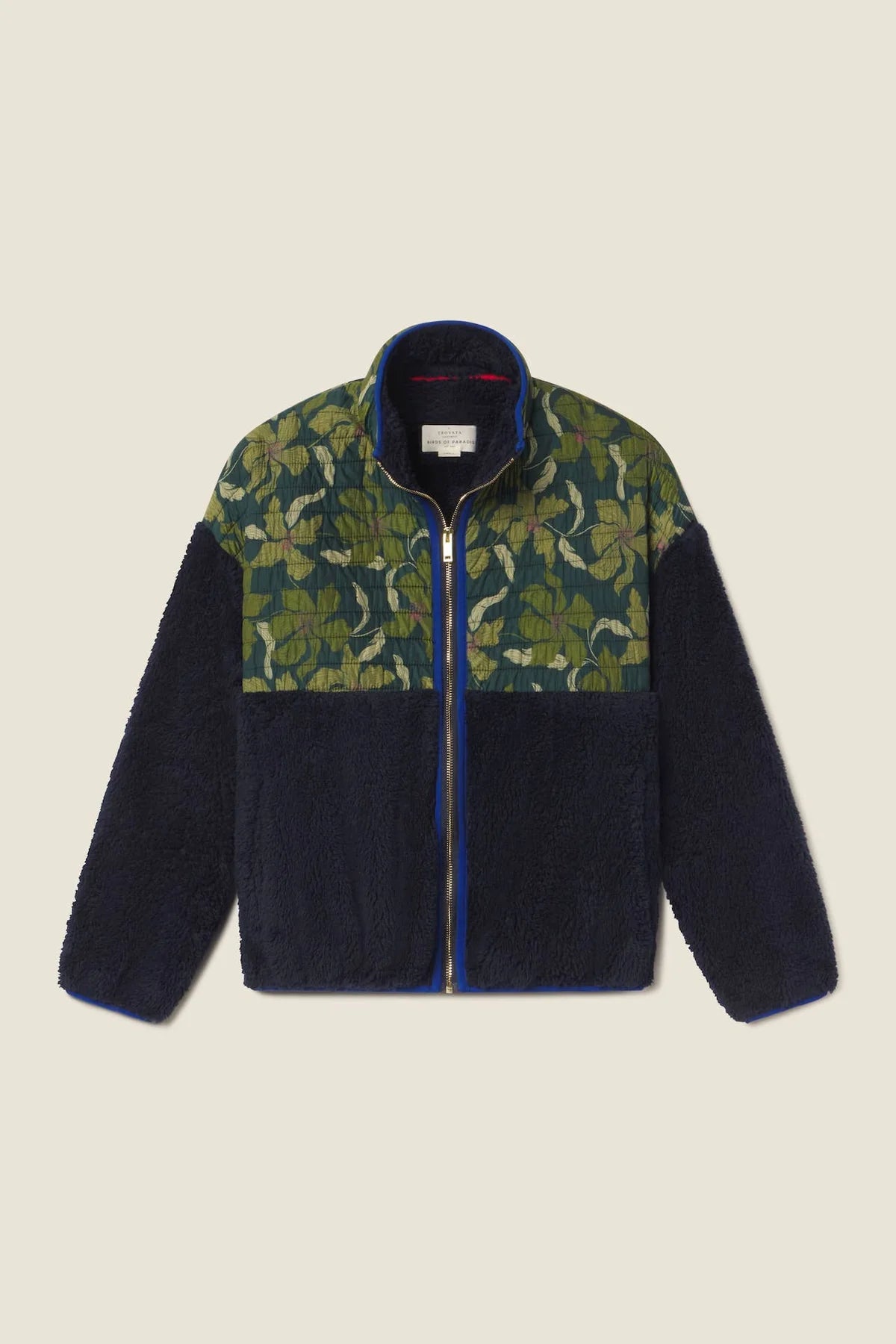 Navy and green patterned jacket on a beige background