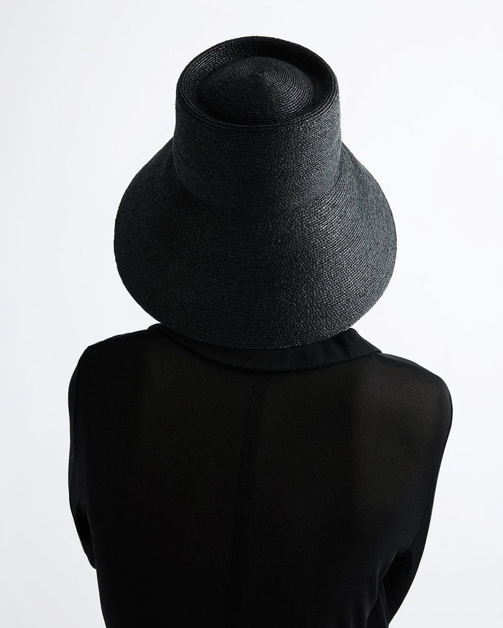 Black knit cowl on a mannequin against a white background