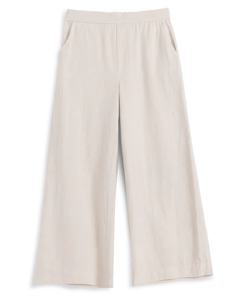 Beige wide-leg pants on a black background