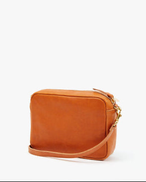 Brown leather crossbody bag on a white background