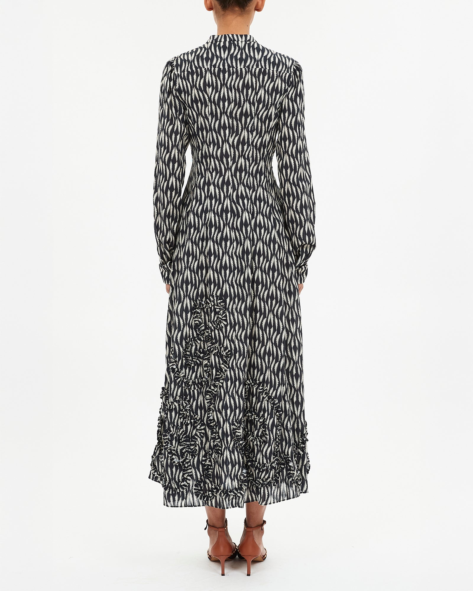 Long black and white patterned dress on a white background