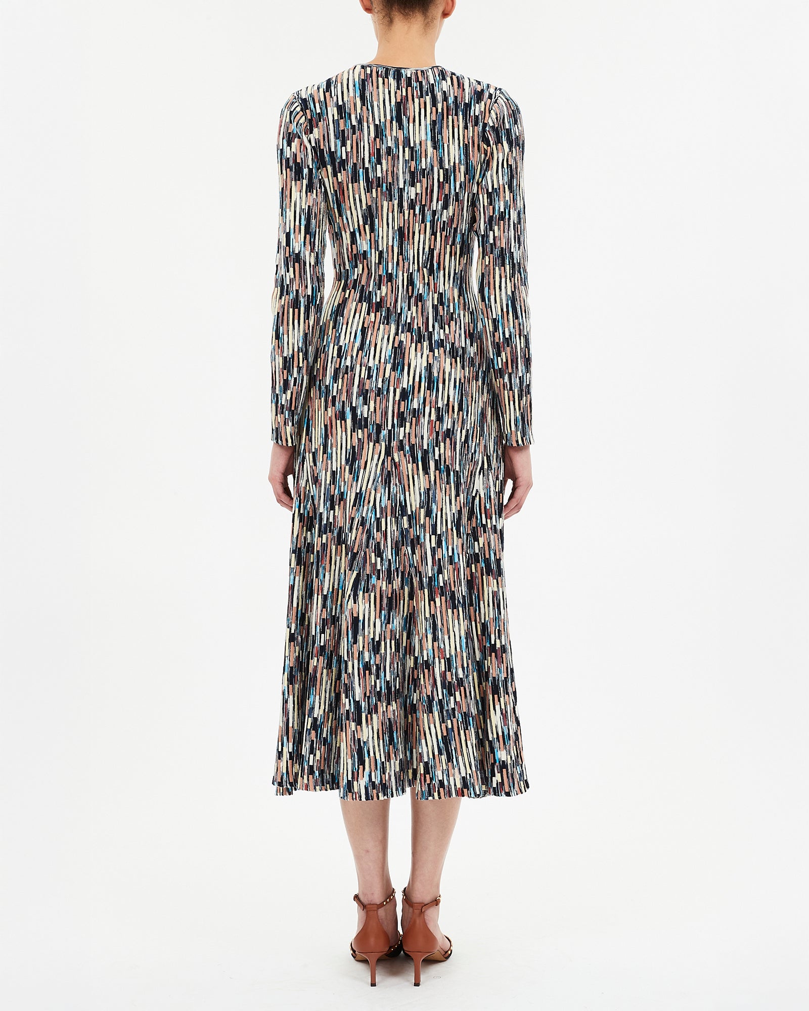 Patterned dress worn by a person on a white background
