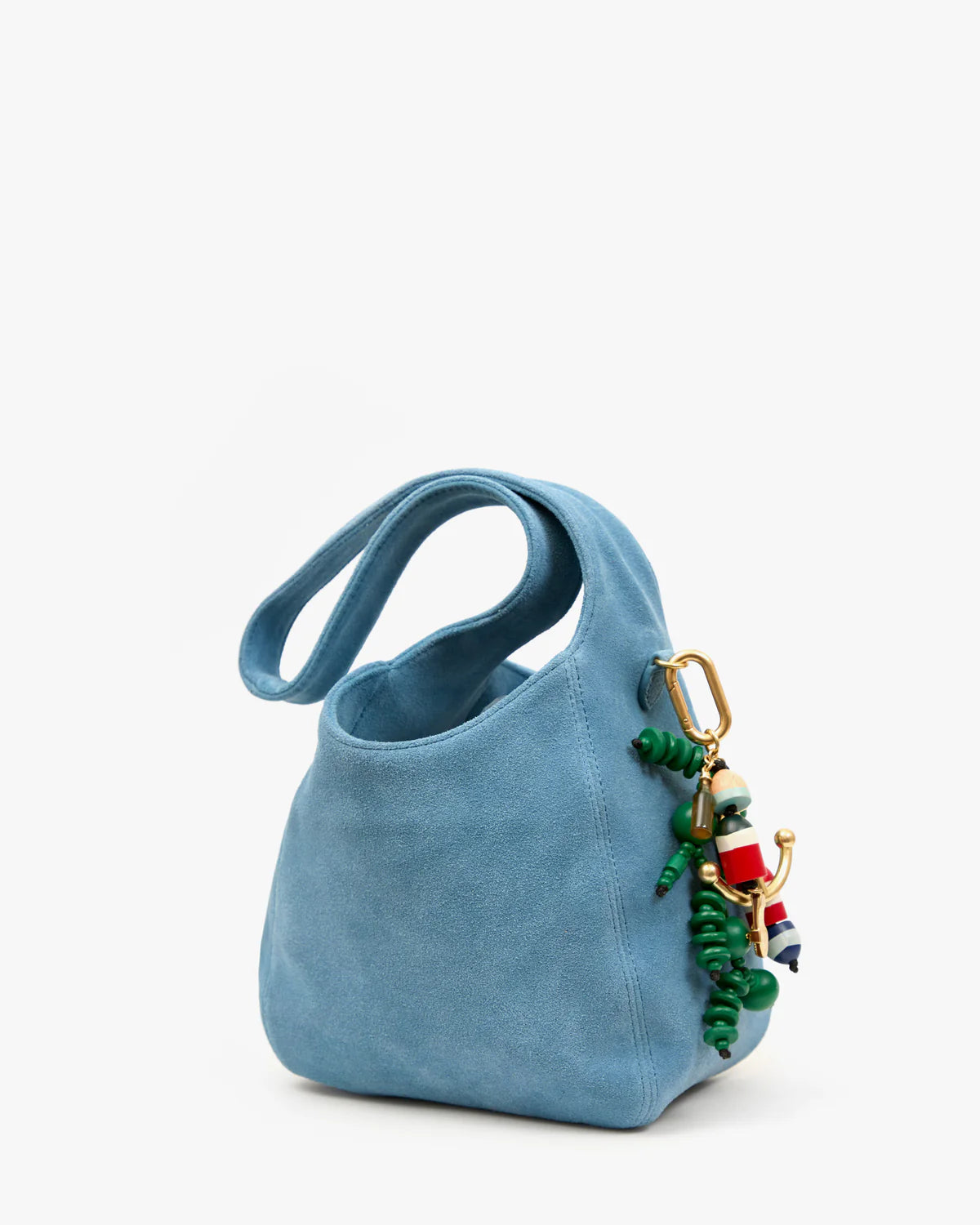 Blue handbag with a colorful charm on a white background