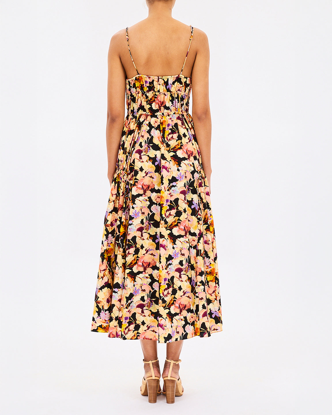 Floral dress worn by a person on a white background