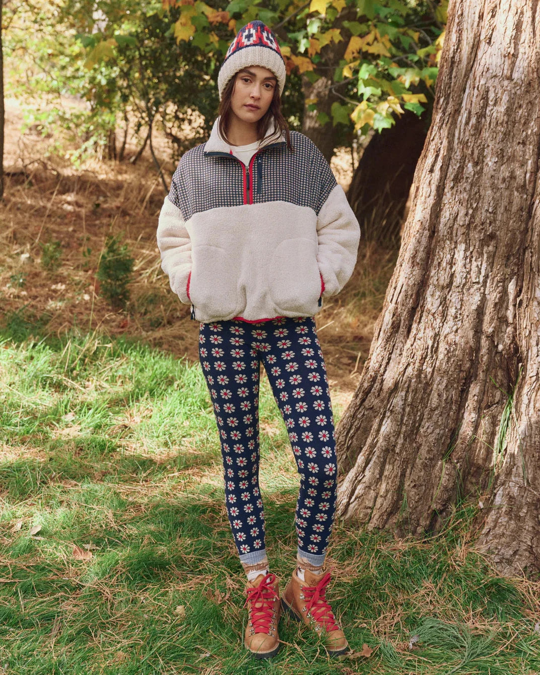 Person wearing a patterned outfit in a forest setting