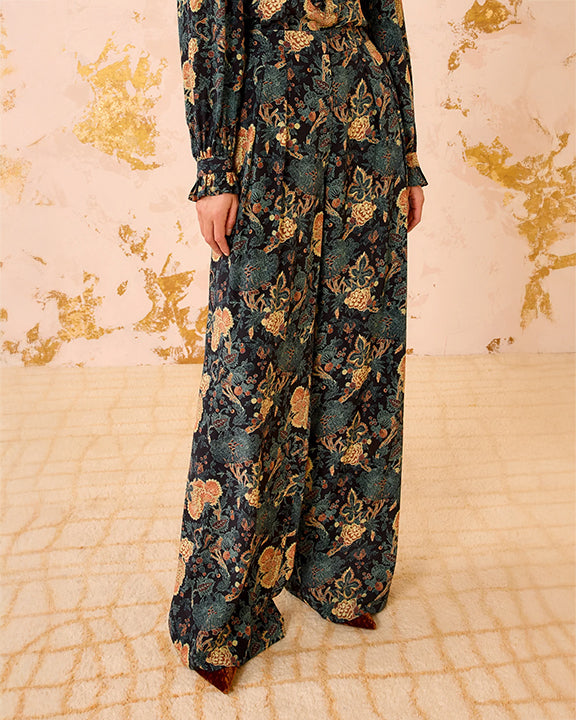 Floral patterned outfit on a textured beige background