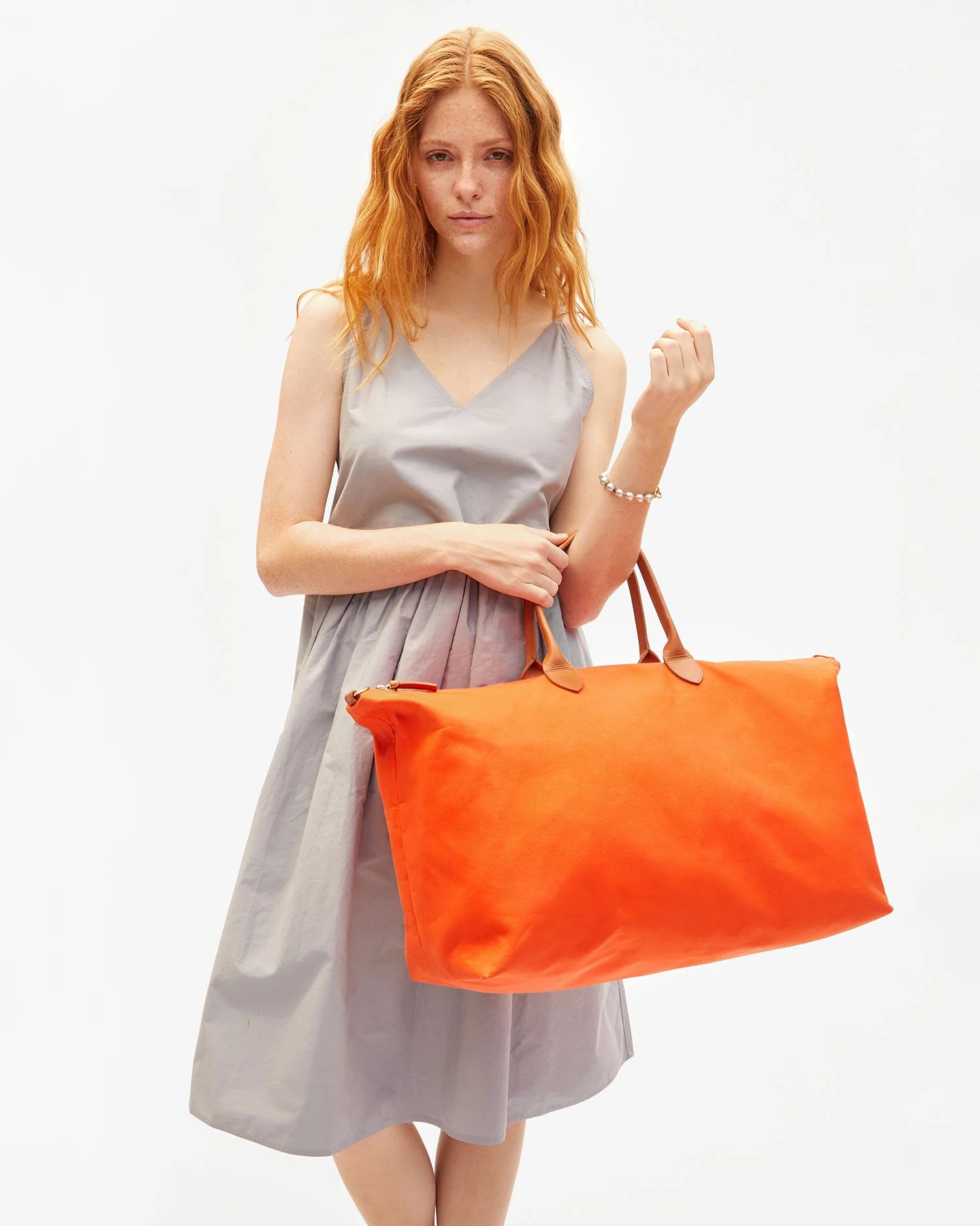 Clare V. Weekender in Tangerine Canvas
