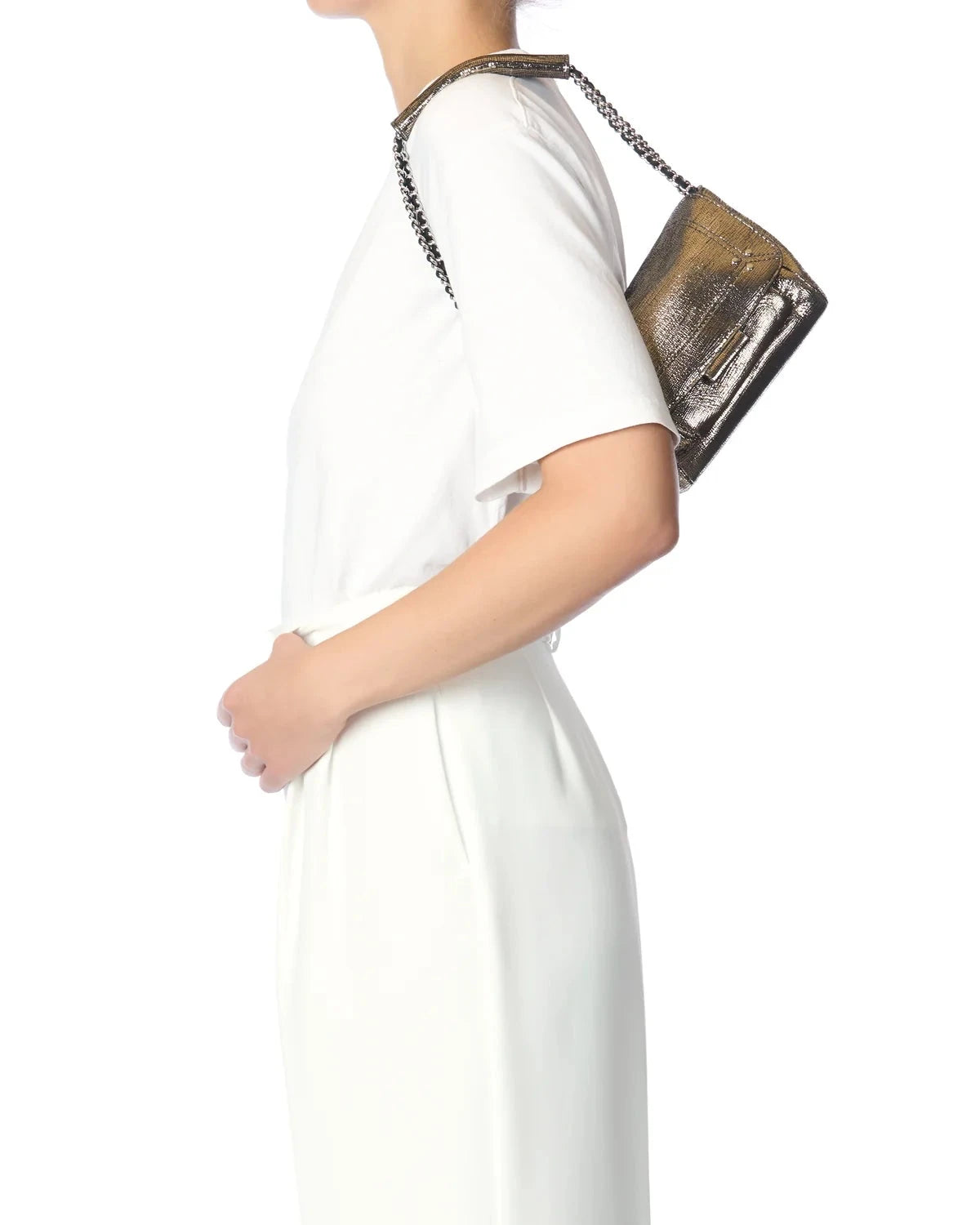 Person wearing a white dress holding a brown handbag on a white background