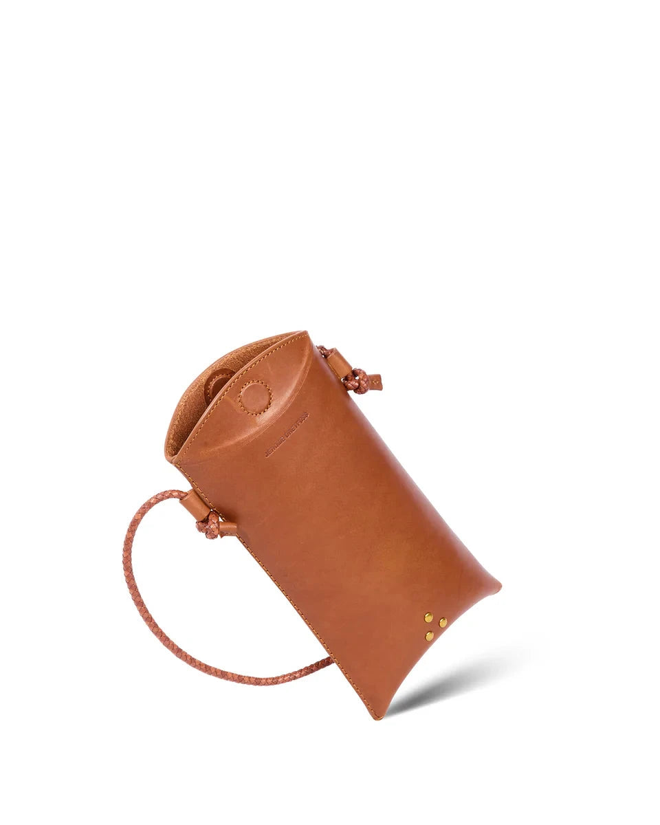 Brown leather pouch with a strap on a white background