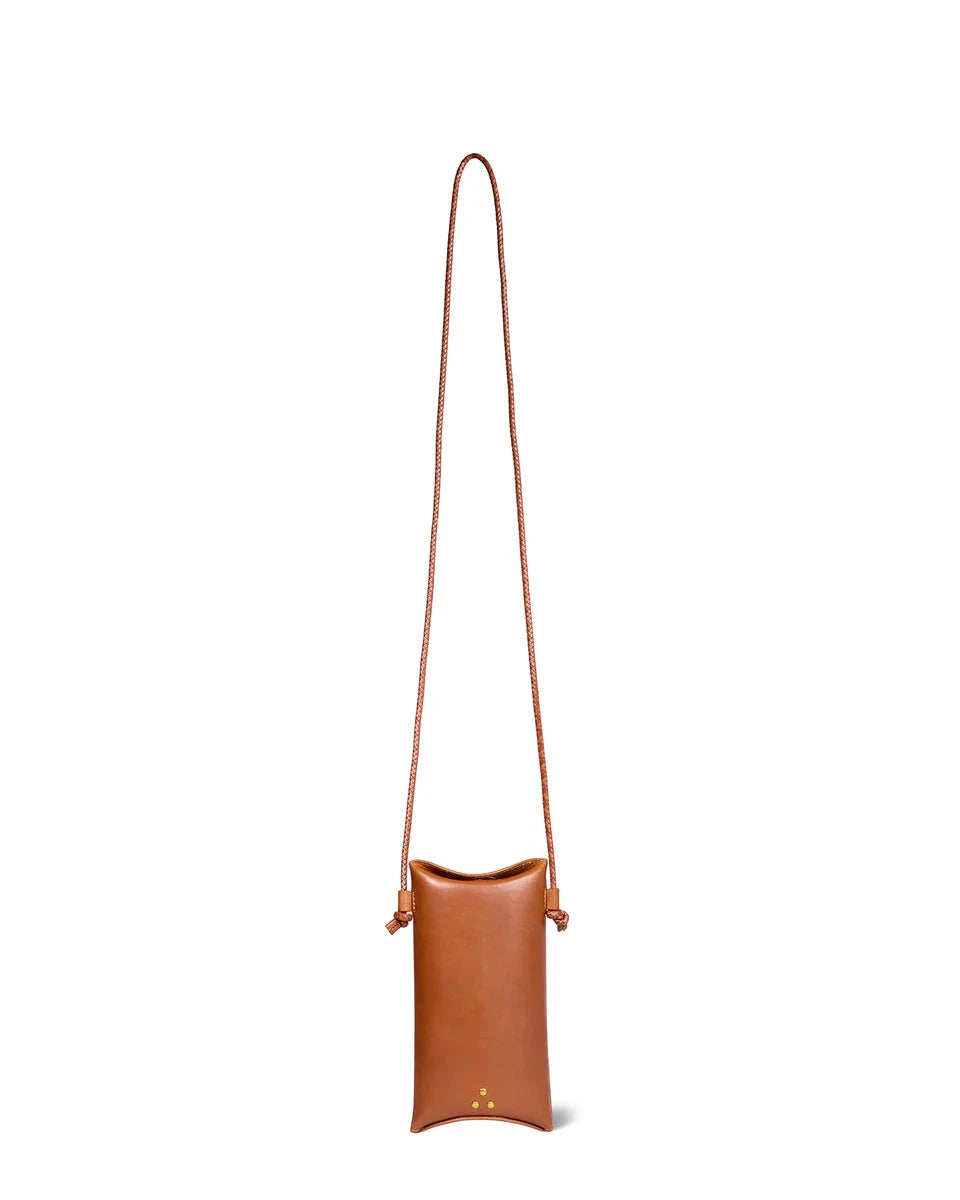 Brown leather crossbody bag with a strap on a white background