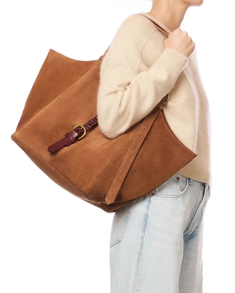 Person wearing a brown leather bag with a white background