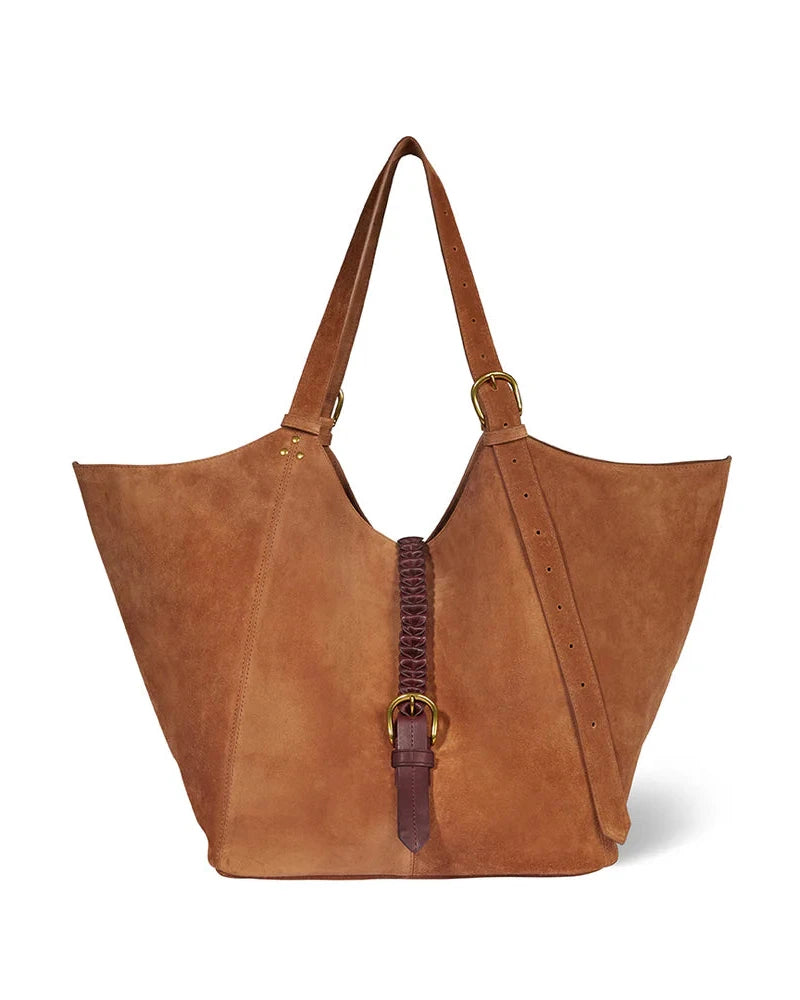 Brown leather tote bag with decorative strap on a white background