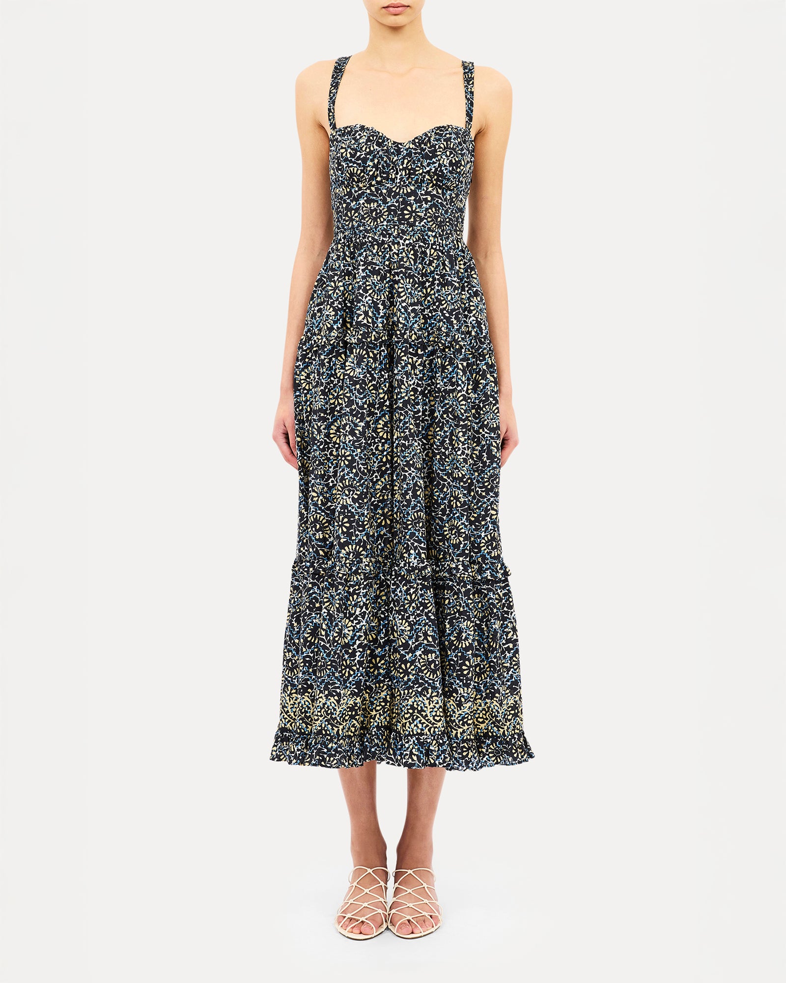 Woman wearing a floral dress on a white background