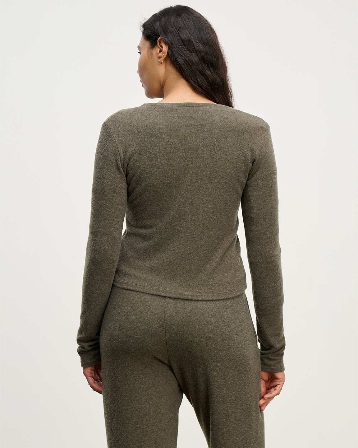 Back of caridgan and sweatpants in a heathered olive color