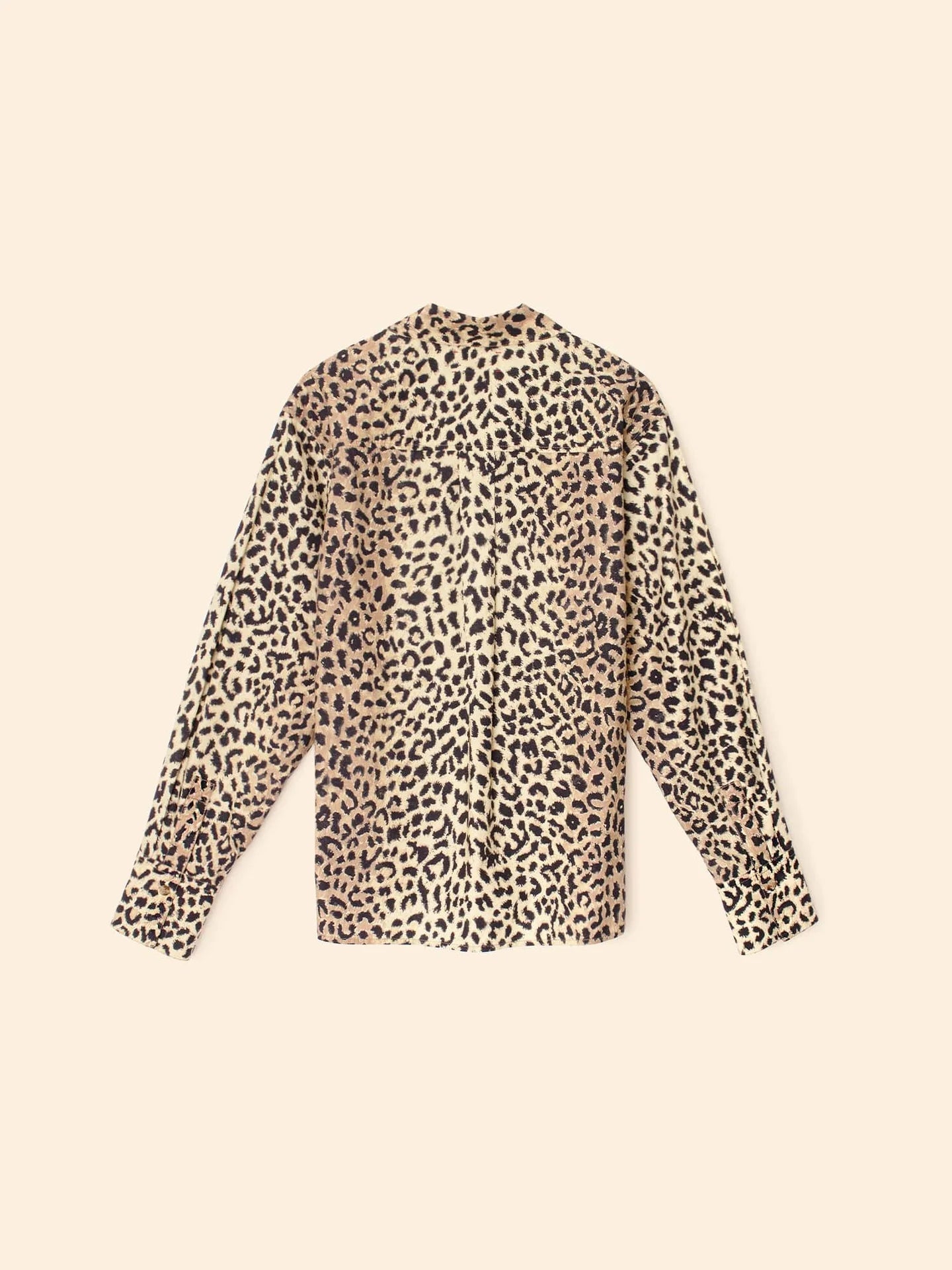 Leopard print blouse on a beige background