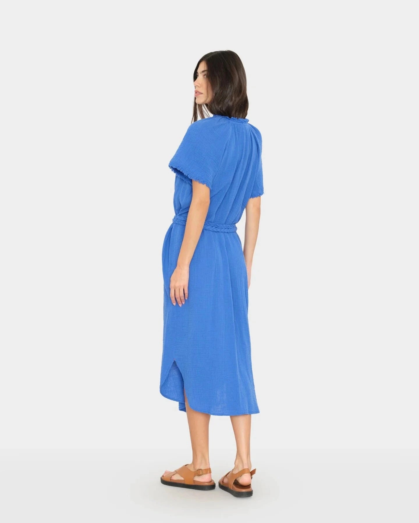 Woman wearing a blue dress on a white background