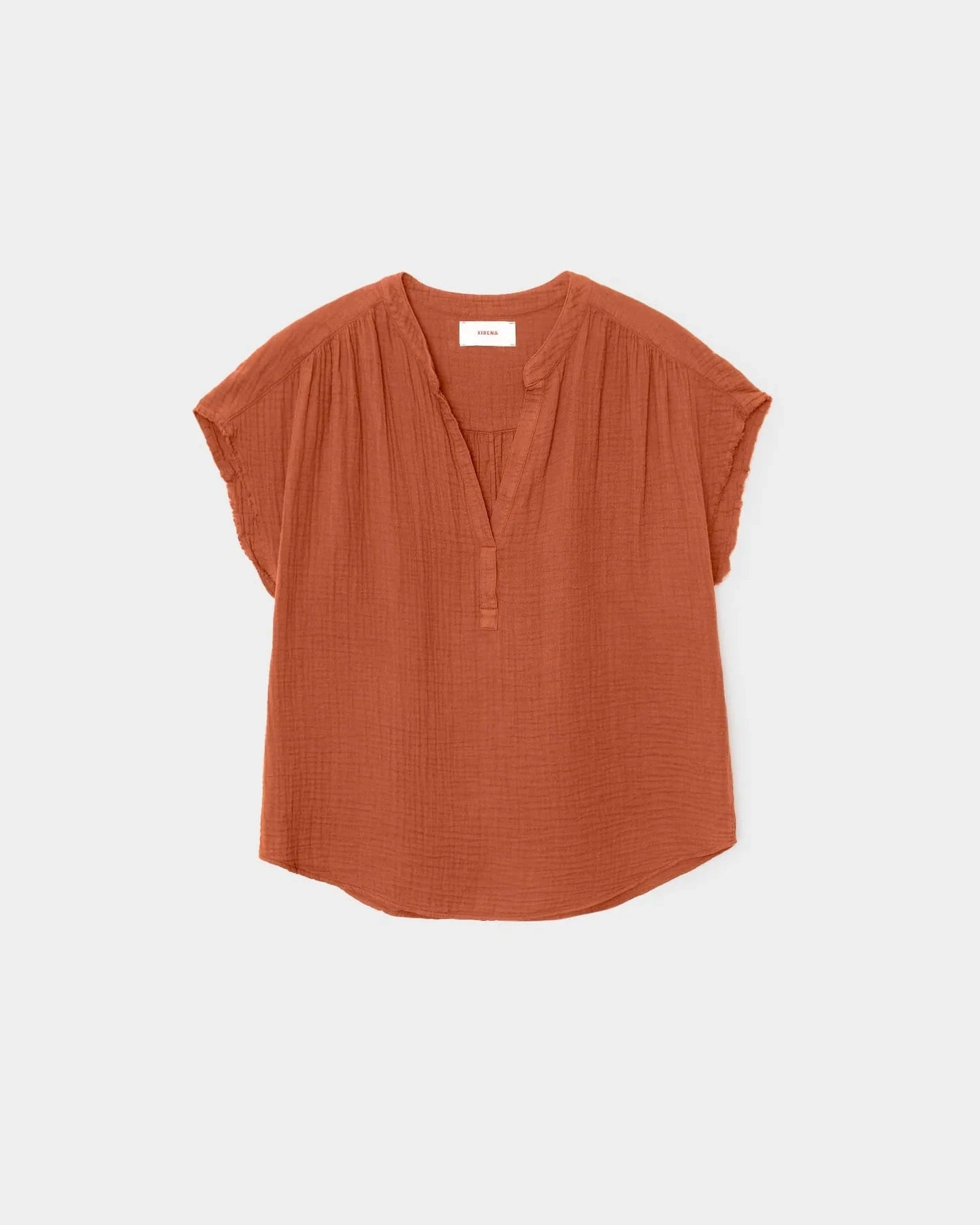 Orange blouse on a light gray background