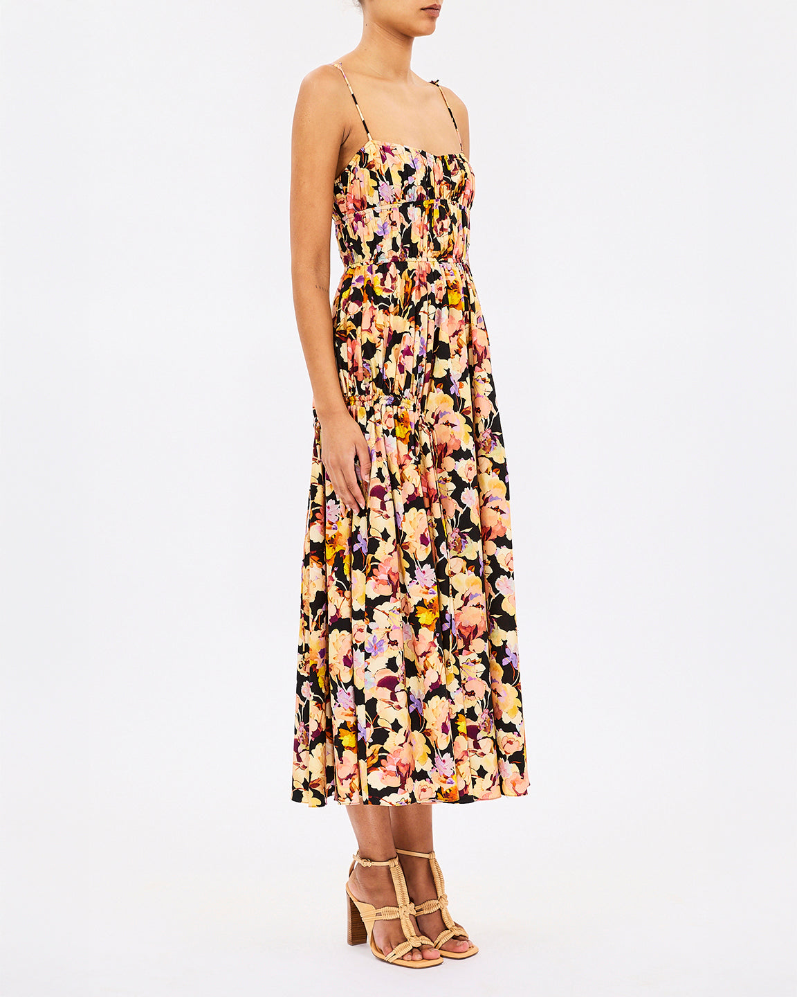 Woman wearing a floral dress on a white background