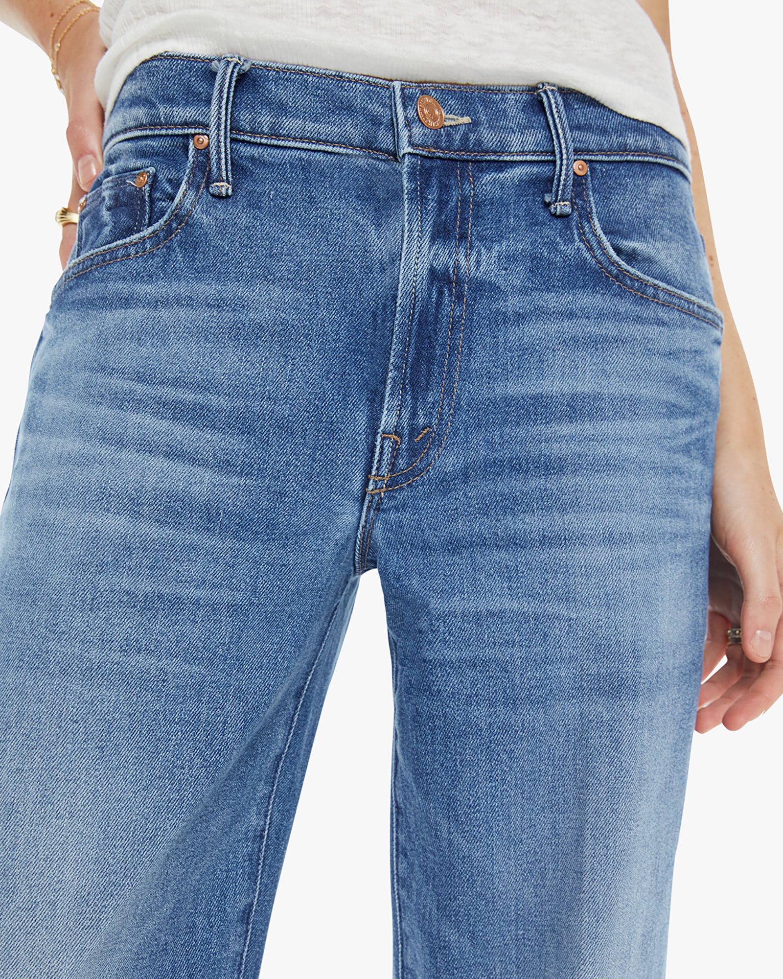 Close-up of blue jeans on a white background