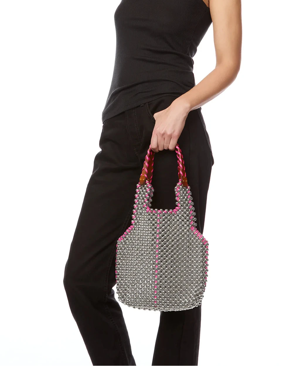 Person holding a beaded handbag with a white background