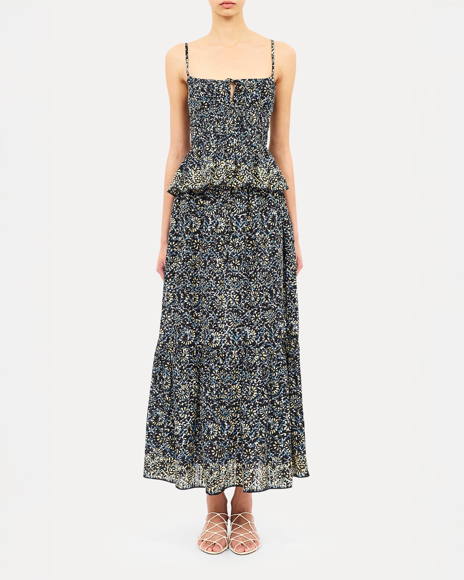 Woman wearing a floral dress on a white background