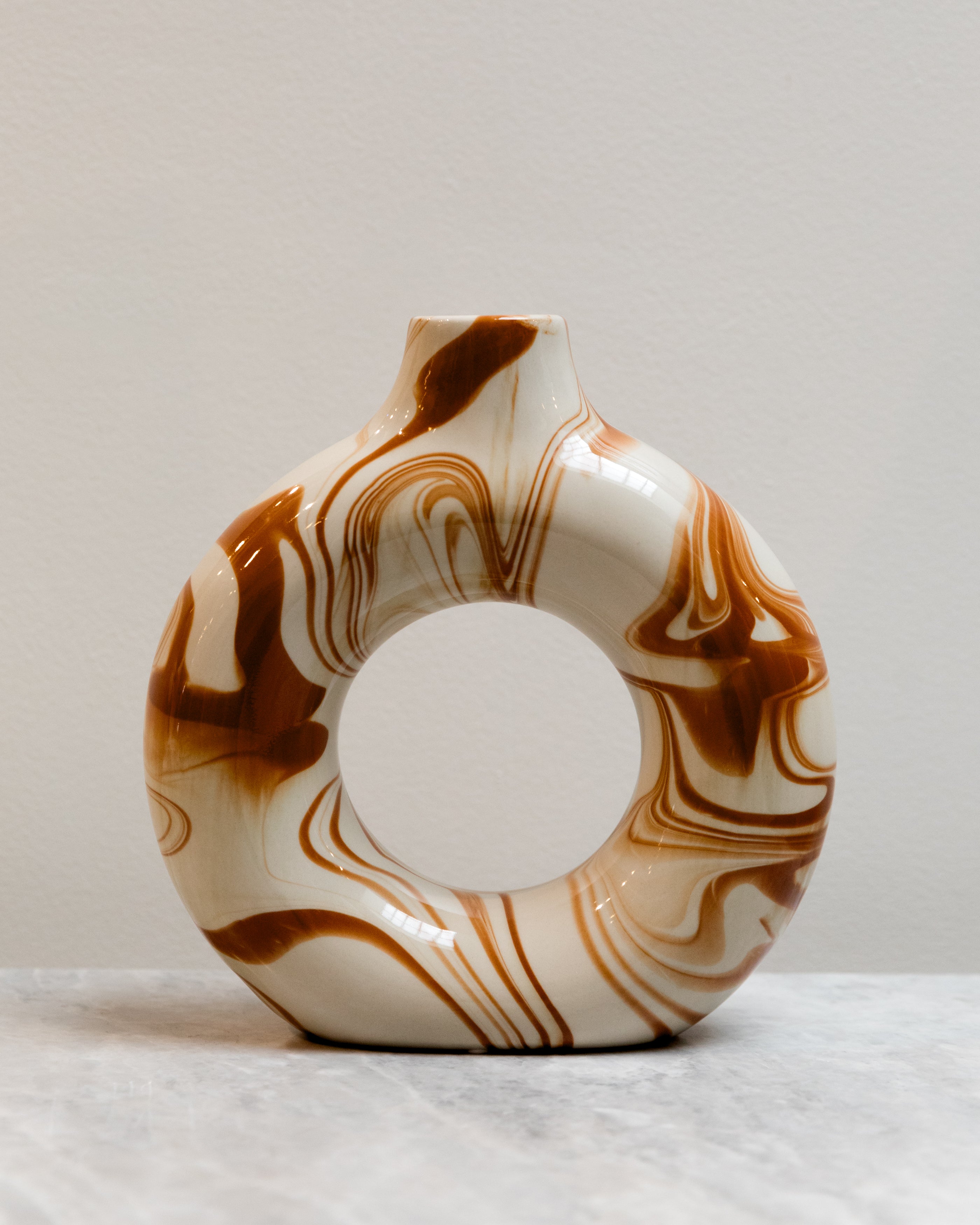 Marbled ceramic vase on a light background