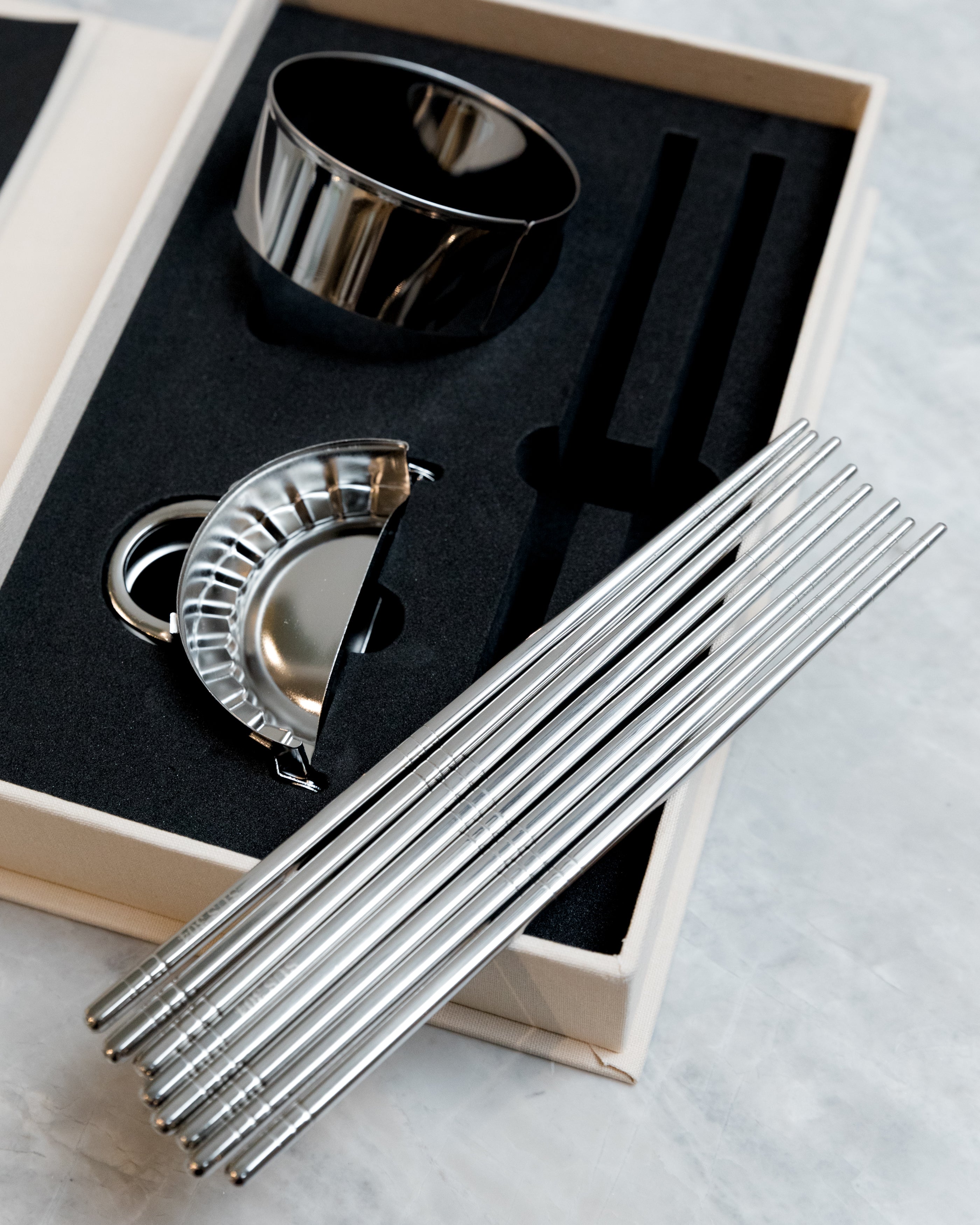 stainless steel dumpling cutter and press and chopsticks