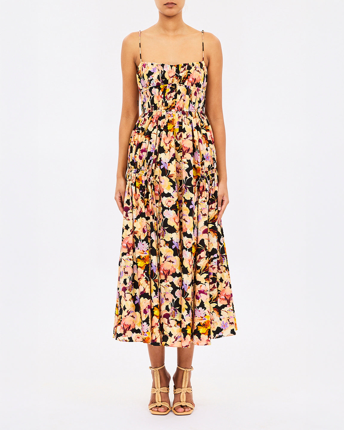 Woman wearing a floral dress on a white background