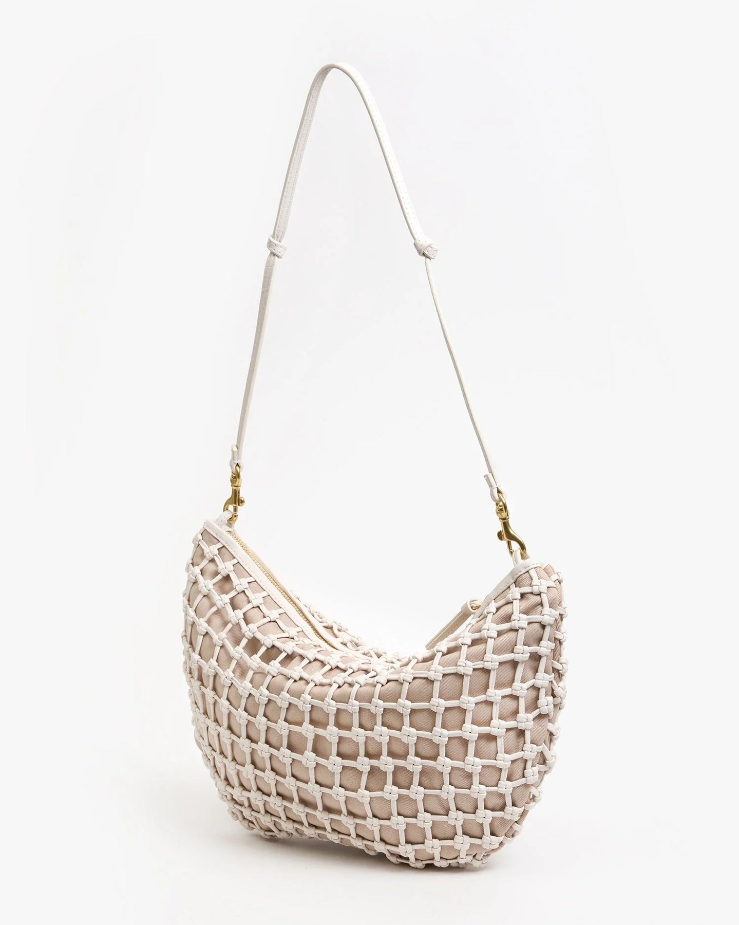 Woven handbag with a strap on a white background