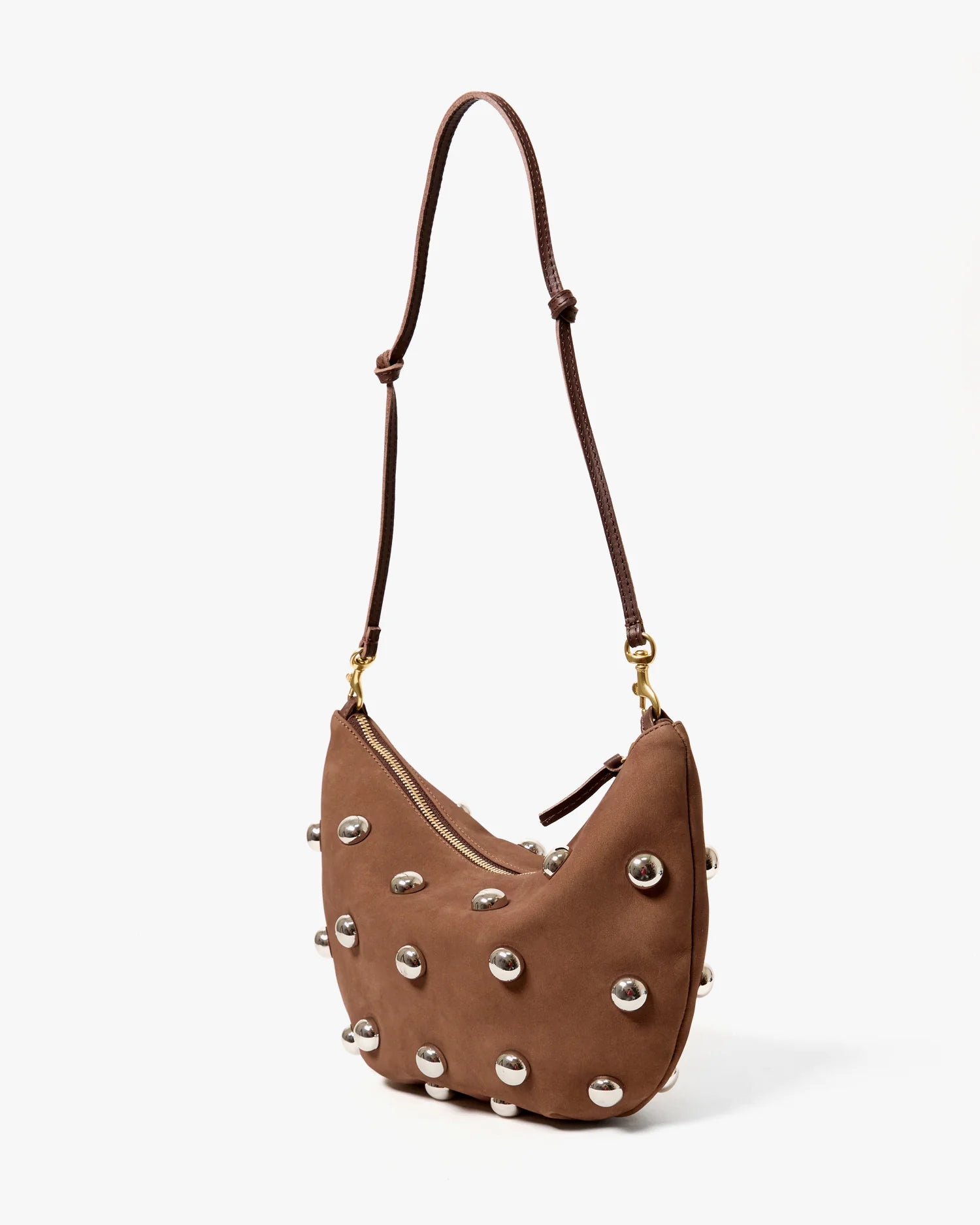 Brown leather handbag with silver studs on a white background