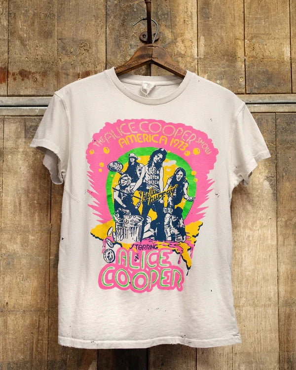 Vintage-style t-shirt with graphic design of Alice Cooper on a wooden background