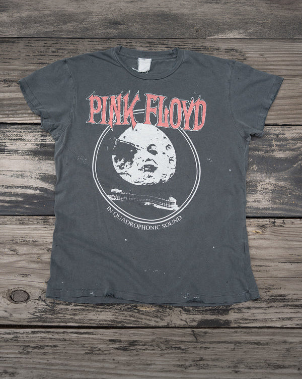 Vintage Pink Floyd t-shirt on a wooden surface