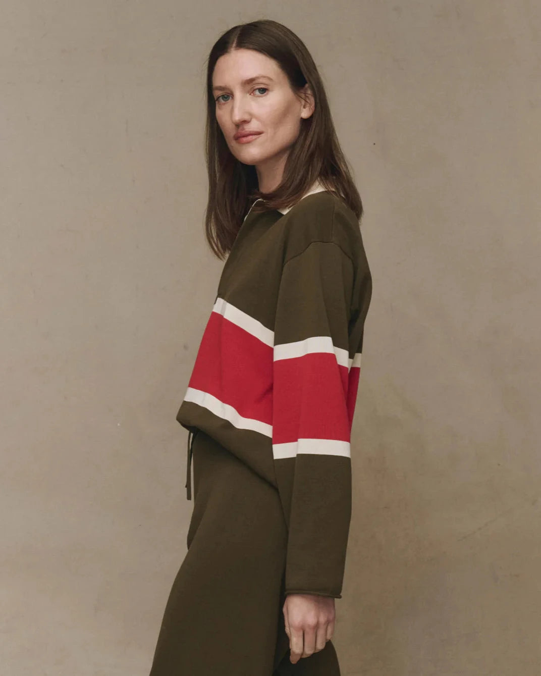 The Great. The Rugby Sweater in Army with Hot Red Stripe