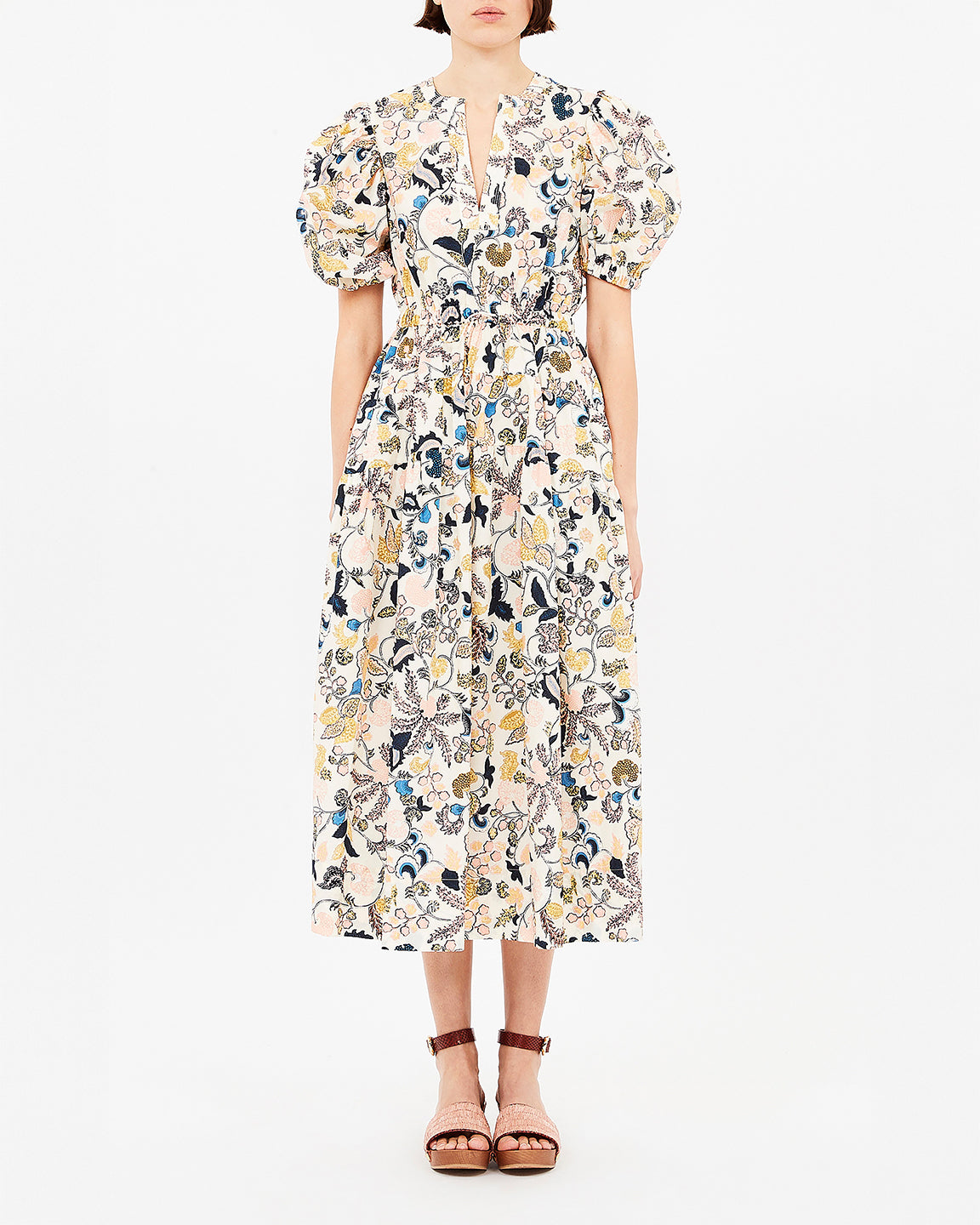 Woman wearing a floral dress on a white background