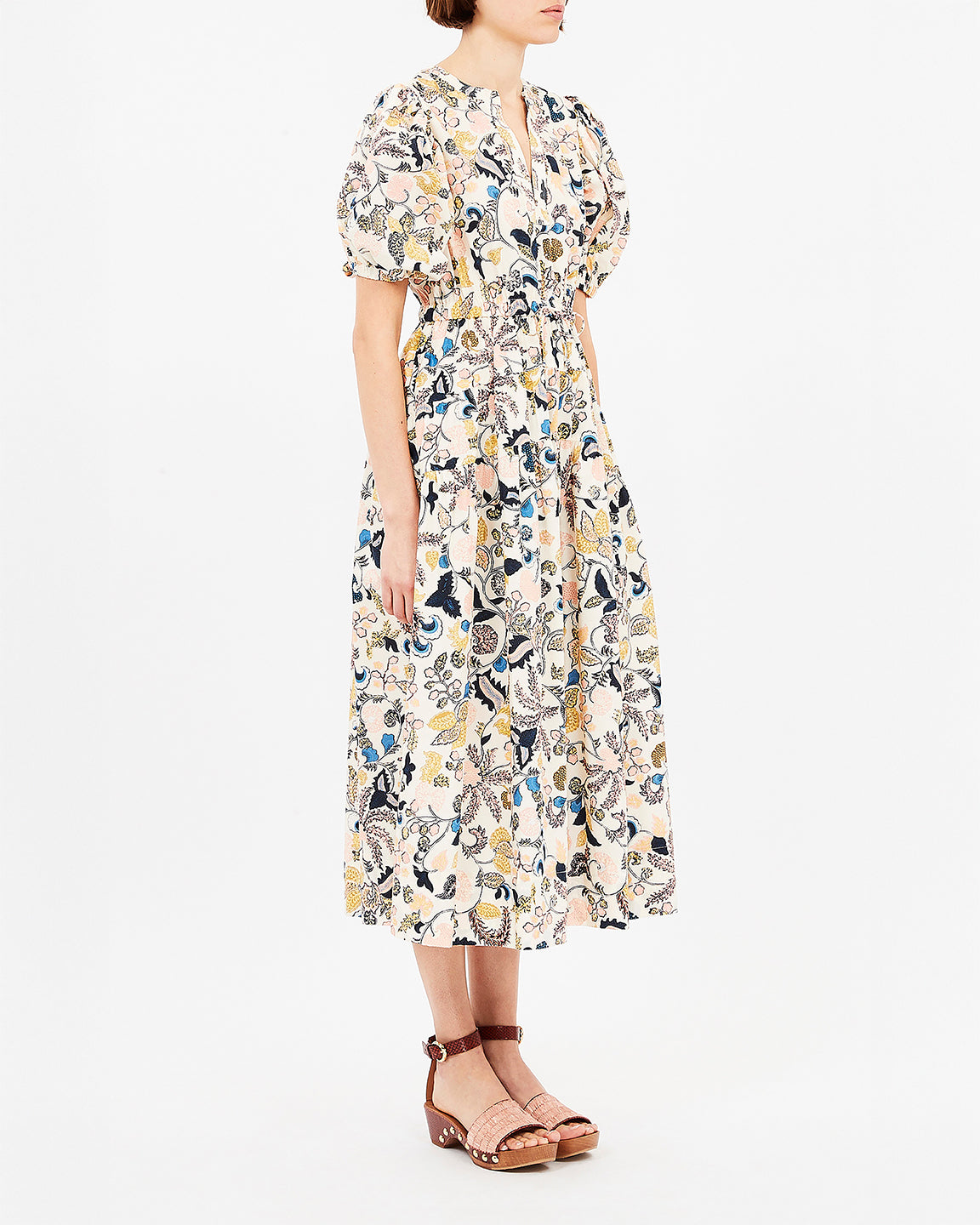 Woman wearing a floral dress on a white background
