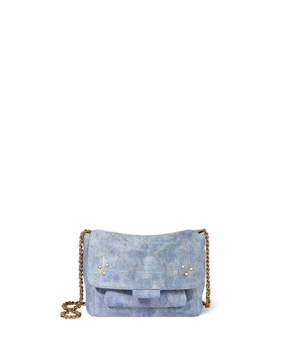 Blue suede handbag with gold chain strap on a white background