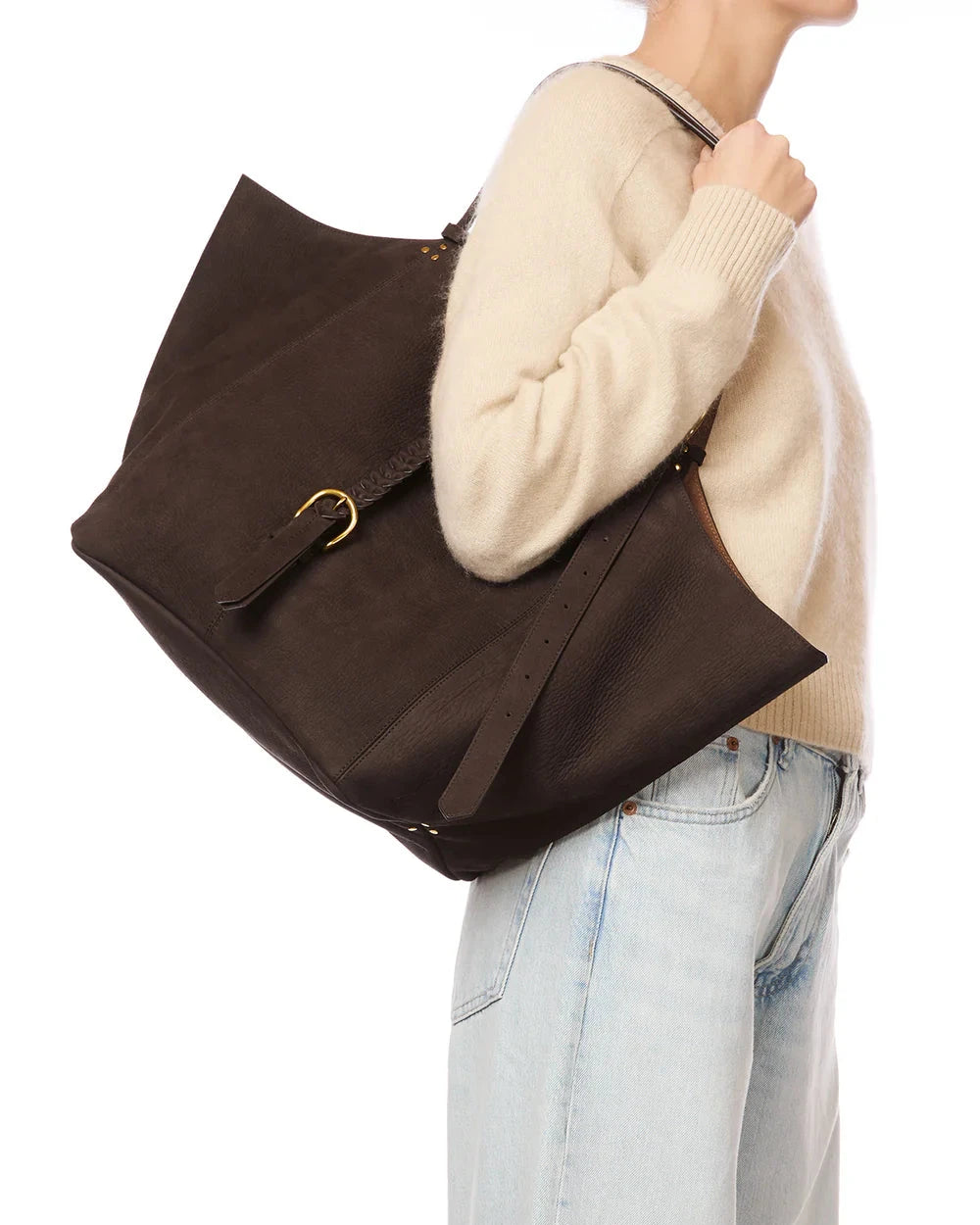 Person holding a brown bag with a white background