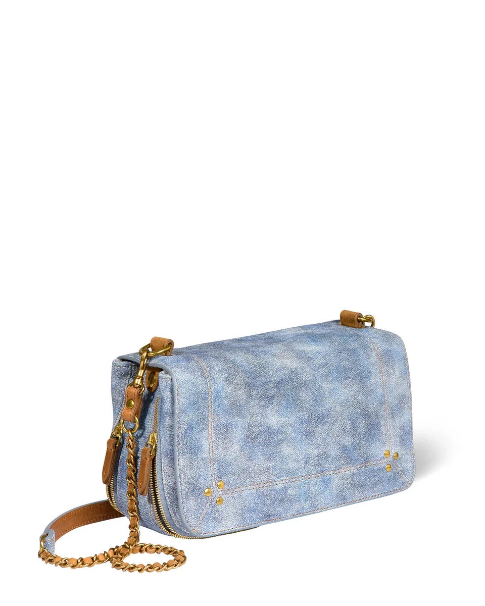 Denim handbag with gold chain on a white background