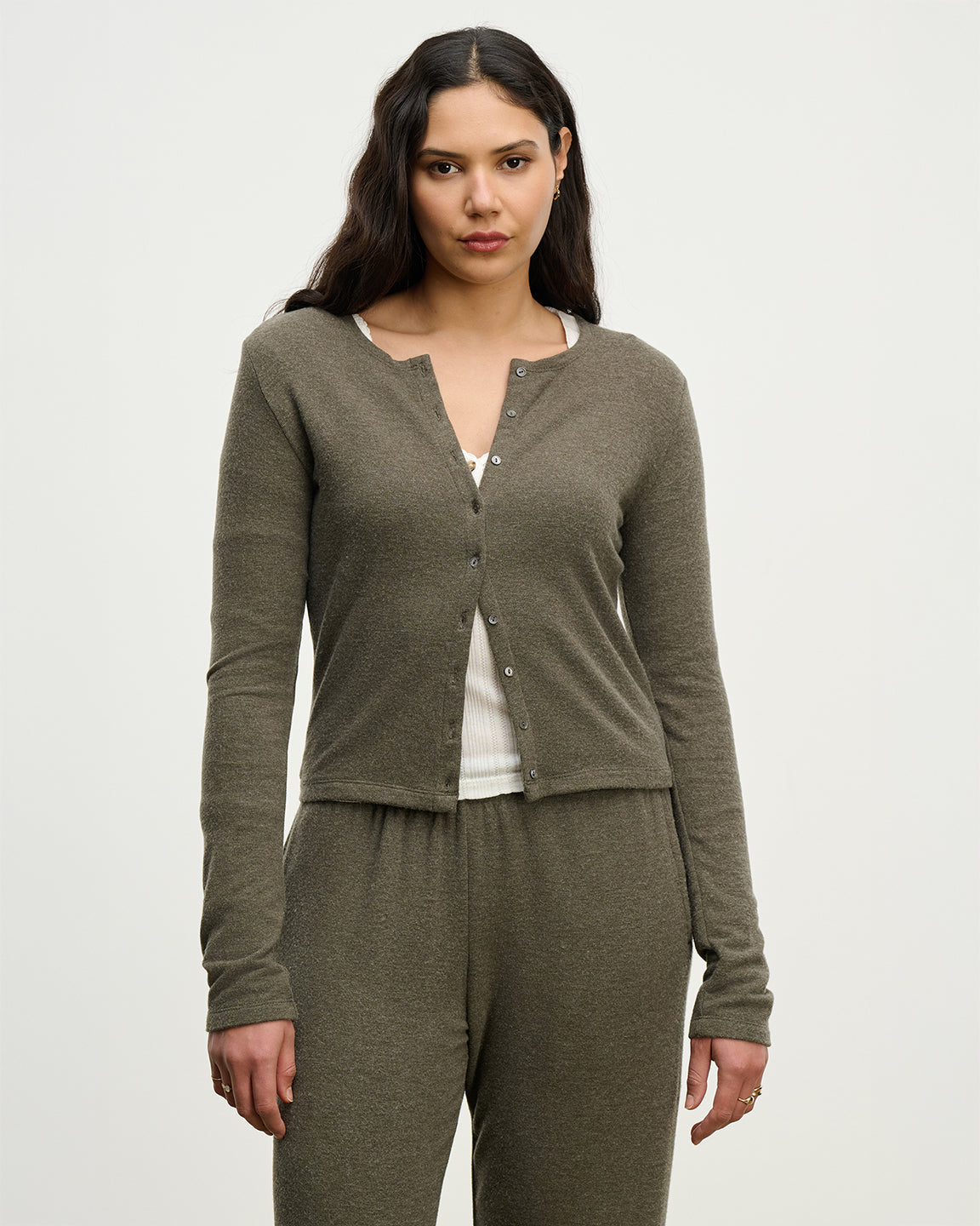 woman wearing a heathered olive cardigan and matching sweatpants