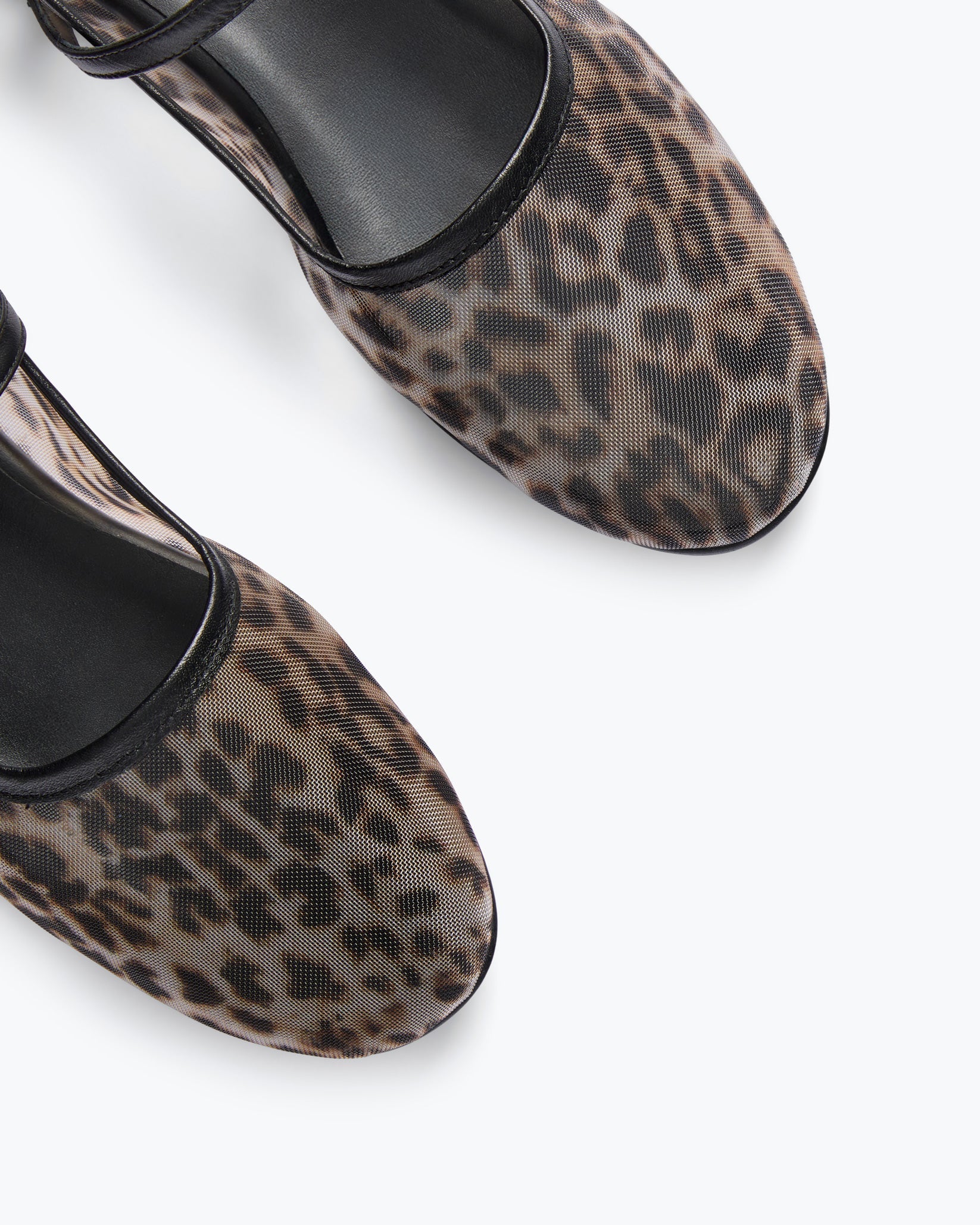 Leopard print shoes with black soles on a white background