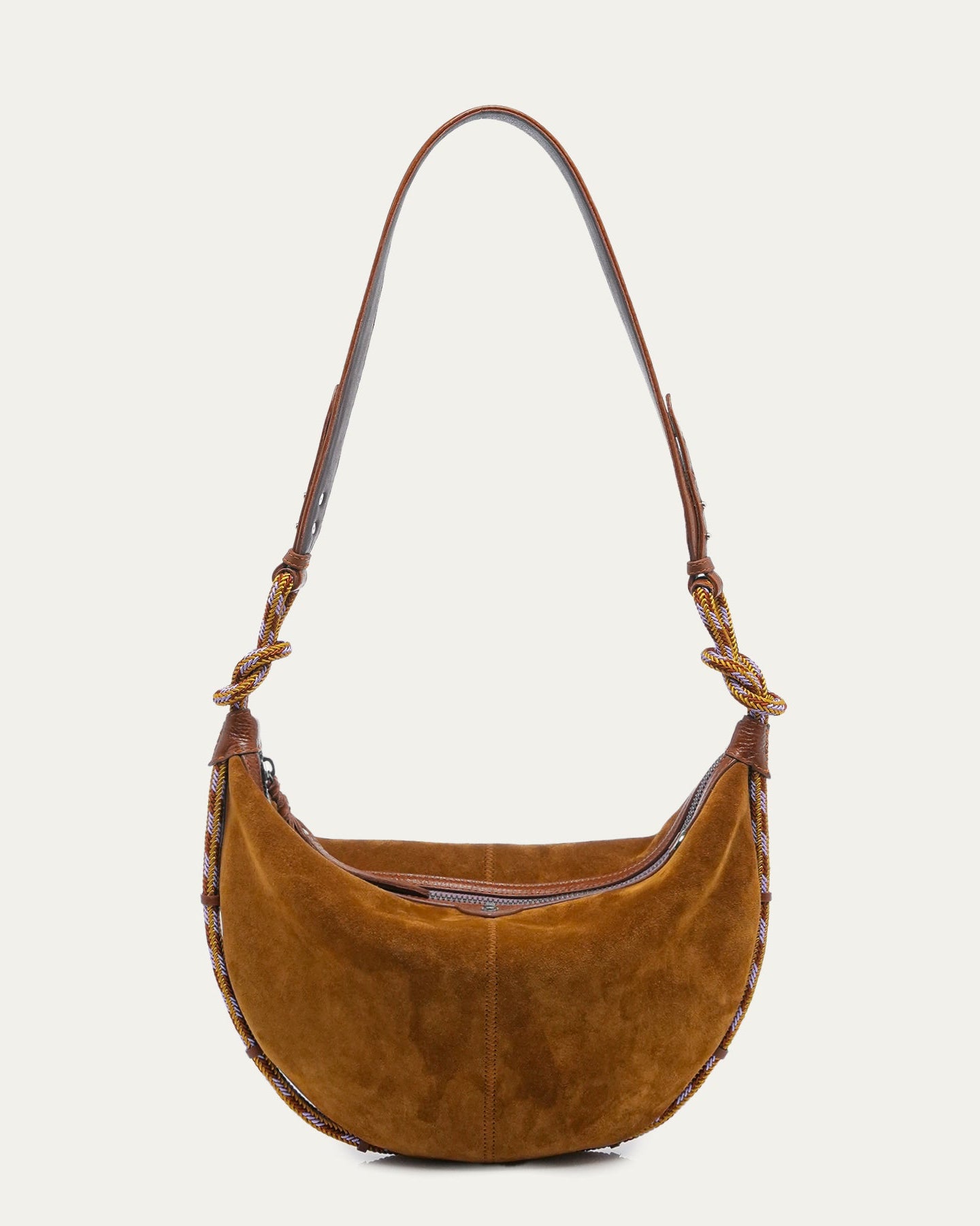 Brown suede handbag with braided handle on a light gray background
