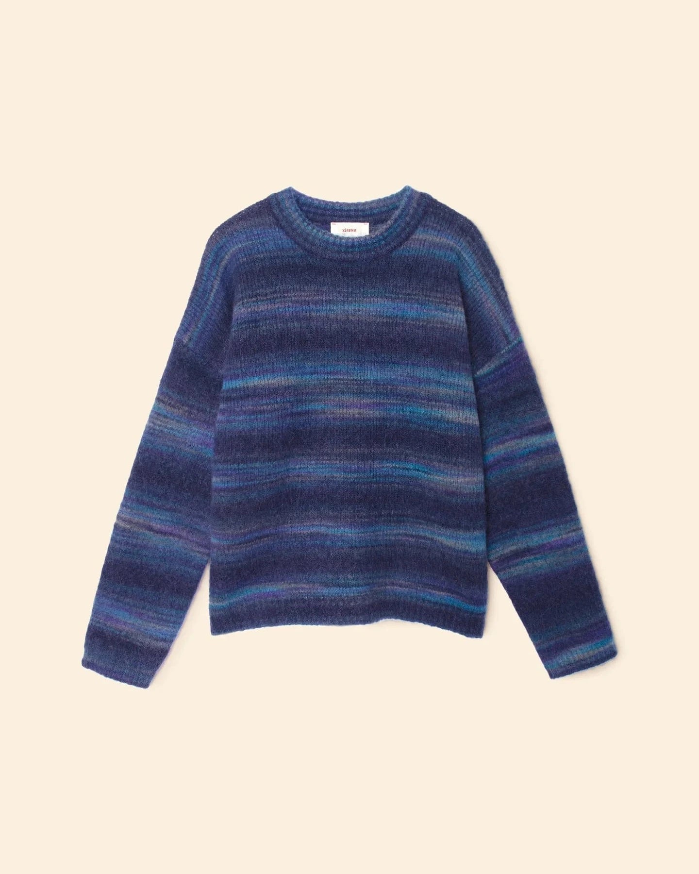 Blue striped sweater on a beige background