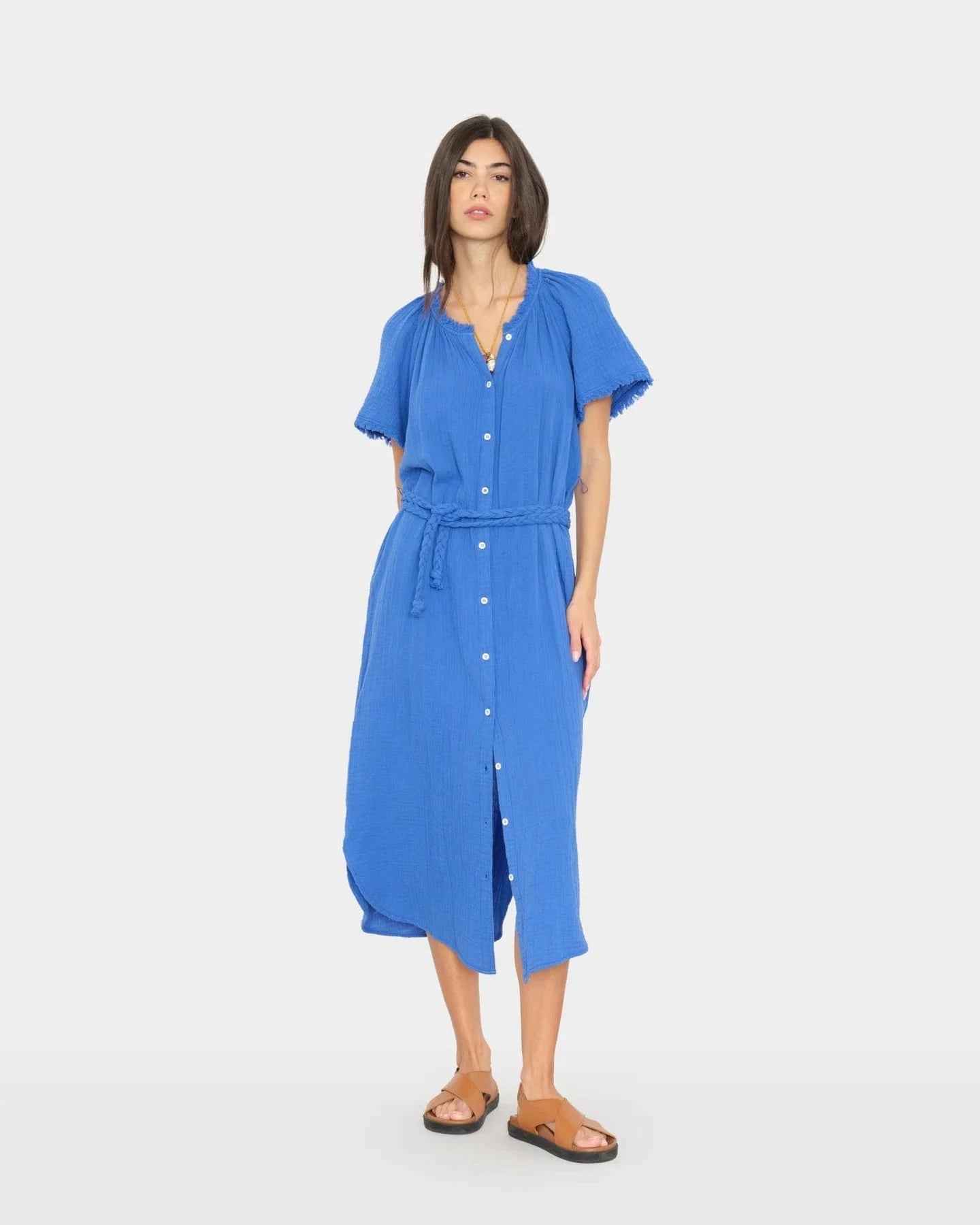 Woman wearing a blue dress on a white background
