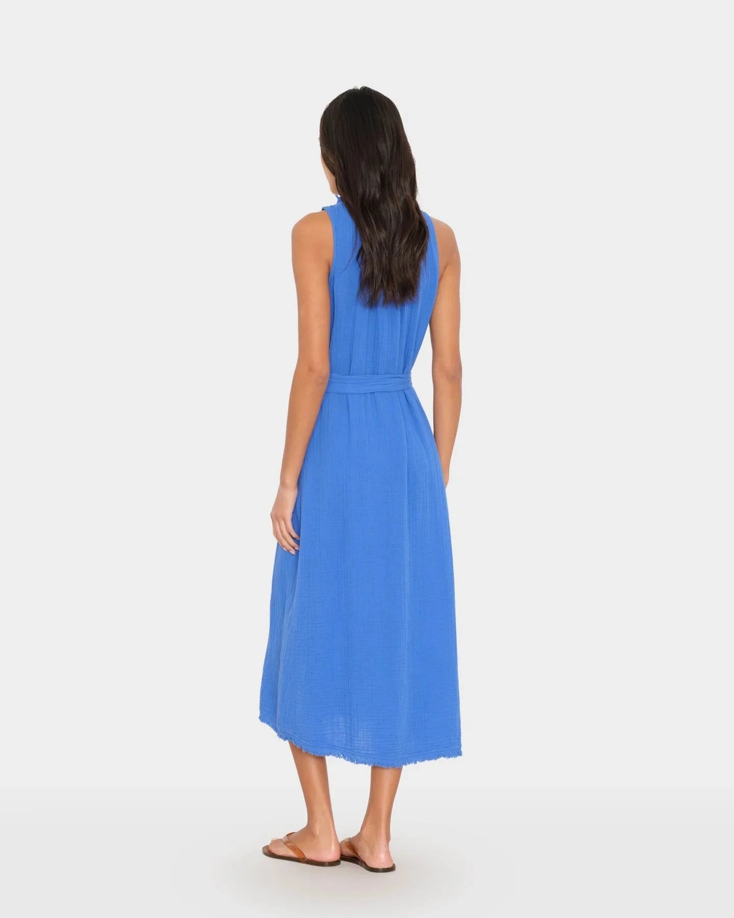 Woman wearing a blue dress on a white background