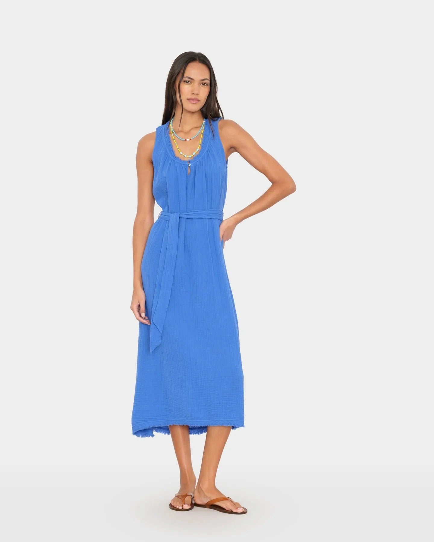 Woman wearing a blue dress on a white background